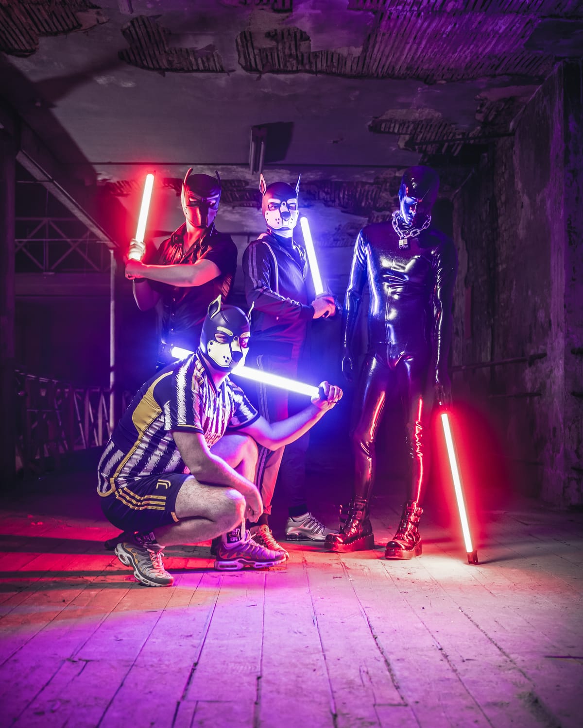 The CH'TI FETISH team in fetish gear, red and blue neon, industrial vibe